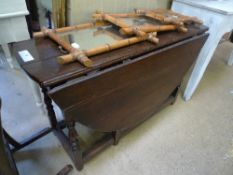 An C18th oak provincial gateleg table with oval flaps raised on turned supports W 140 D 107 H 68 cm