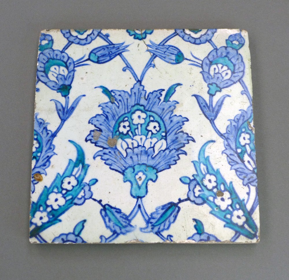 A C16th Turkish Iznik pottery tile of square form decorated  with underglaze in cobalt blue and
