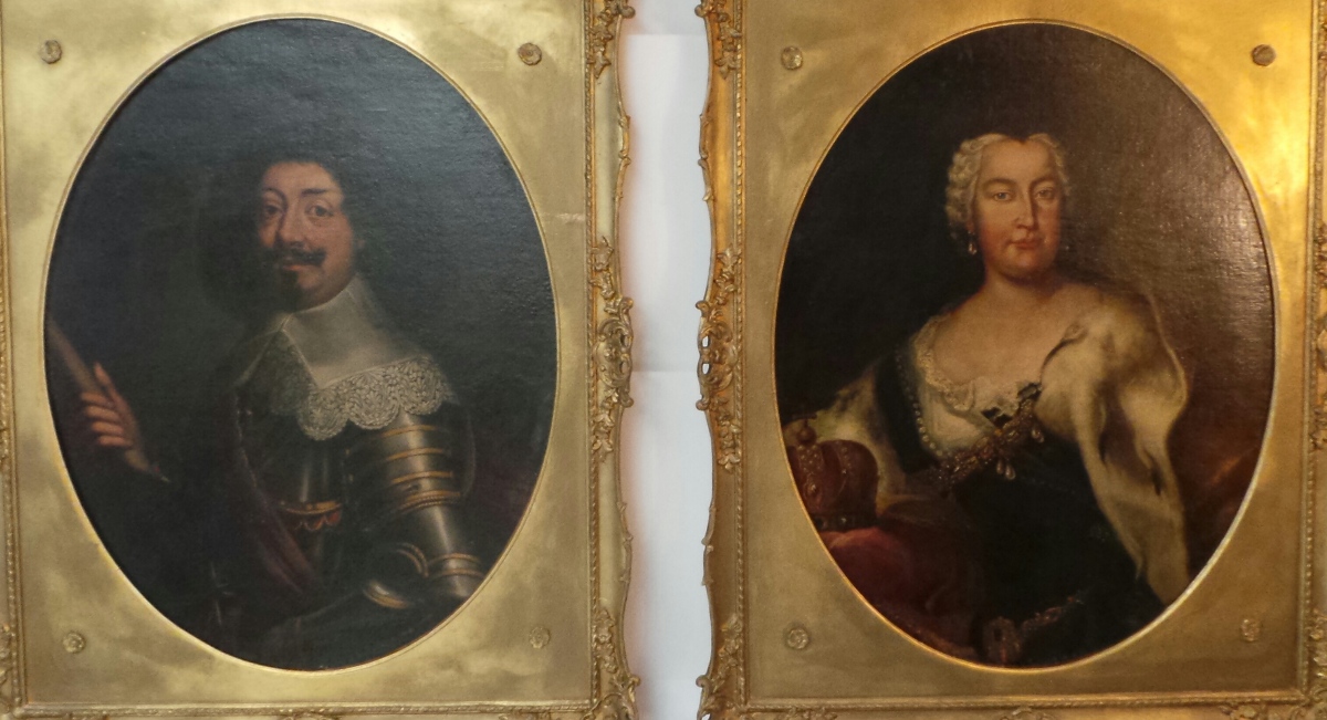 A pair of Victorian oval oils on canvas portrait studies of a man and a woman in traditional C17th