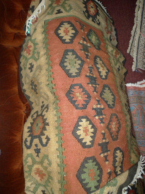 A hand knotted Persian Kilim carpet the beige and red field with geometric decoration W 100 cm x L