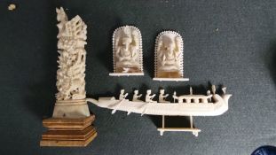 A collection of four Indian ivory carvings including two Ganesh idols, deity totem and phoenix boat