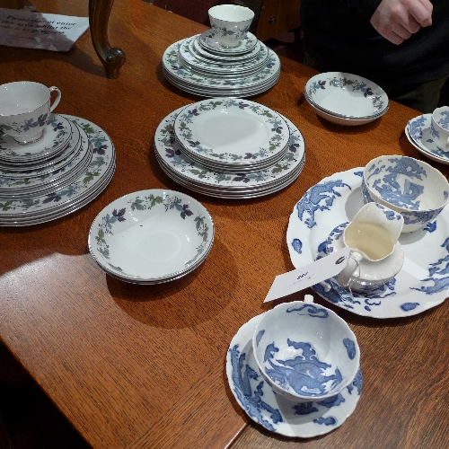 A Royal Doulton Burgundy leafy pattern part dinner service and a blue and white dragon decorated