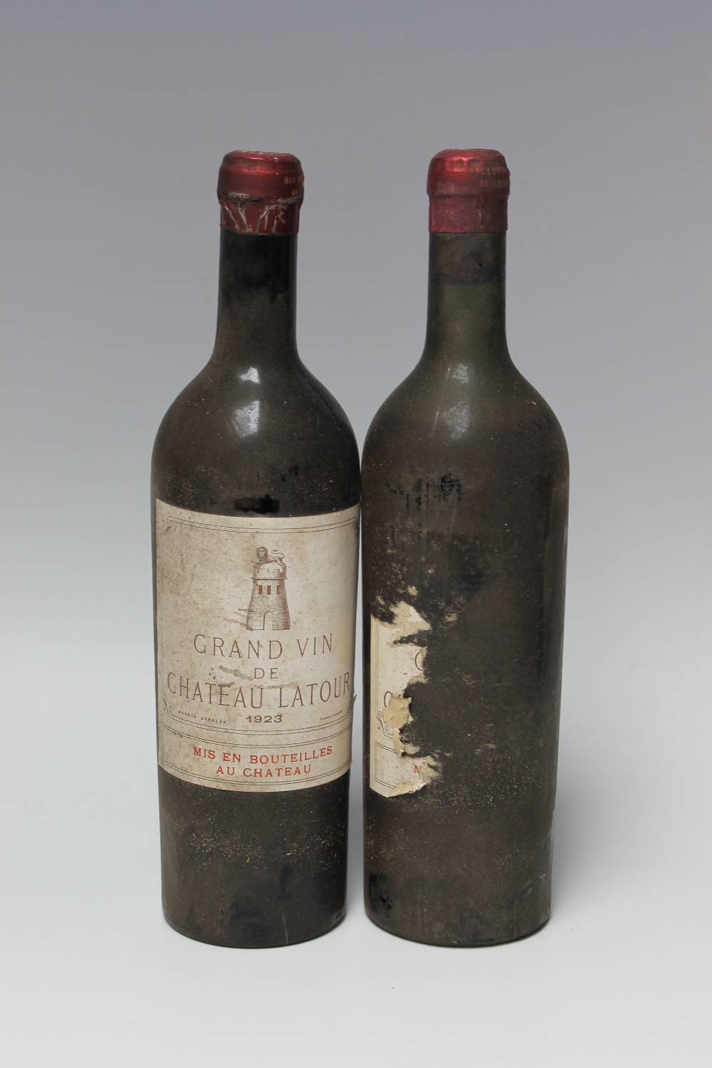 2 BOTTLES OF CHATEAU LATOUR GRAND CRU CLASSE PAUILLAC 1923, bottle A mid shoulder, bottle B no