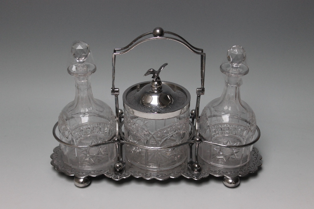 A LATE 19TH CENTURY `WALKER & HALL` SILVER PLATED TANTALUS, with two cut glass decanters and