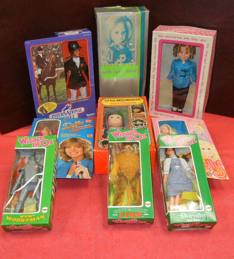 Collection of 1970s and 1980s action figures and dolls.  Includes three Hego Wizard of Oz dolls,