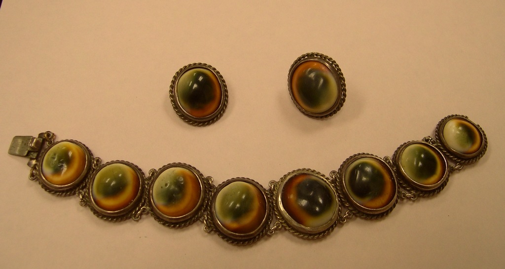 Vintage Costume Cats Eye (shell) Cabochon panel linked bracelet and matching Earrings.Condition: