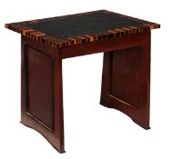 A hardwood, ebonised and coromandel crossbanded side table or desk, 20th century, the leather inset