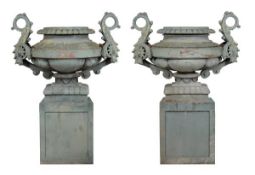 A pair of substantial and impressive Spanish painted cast iron urns on plinths in the early