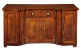 A Regency mahogany and crossbanded breakfront serpentine sideboard, circa 1815, the top with inlaid