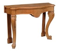 An William IV oak console table, circa 1835, with serpentine front and single blind frieze drawer