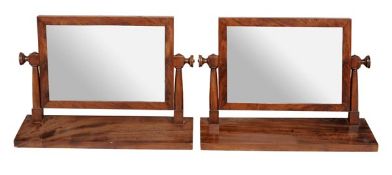 A pair of George IV mahogany dressing mirrors circa 1825 each with rectangular plate within a