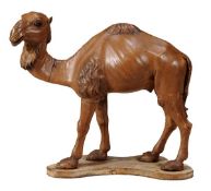 A Continental painted pine model of a standing Dromedary camel, 19th century, on shaped base, 50cm