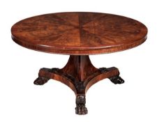 A Regency partridge-crossbanded mahogany circular breakfast table, circa 1815, probably Irish, the