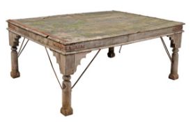An Indian teak garden table, late 20th century, the substantial top with iron strapwork and on