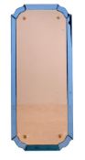 A blue glass framed wall mirror, circa1930, with shaped and beveled peach glass plate within the