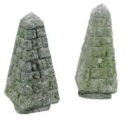 A pair of limestone gate finials, 20th century, of pyrimidal form and with carved brick effect