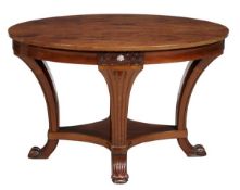 An Art Nouveau walnut oval centre table, early 20th century, with decorative carving and mother-of-