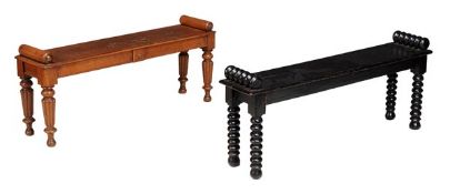 A Victorian oak hall bench, Circa 1850, the frieze with central painted armorial crest and set on