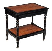 A late Victorian satinwood and ebonised two tier side table, circa 1890, with turned and carved