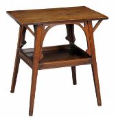 An oak two tier table early 20th century the rectangular top with pierced spandrels, the lower tier