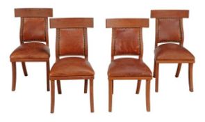 A set of four hardwood and leather upholstered chairs, in Empire style, 20th century, the
