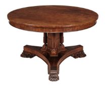 A George VI walnut circular centre table, circa 1825, on triple pillars and central support above