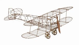 A wirework model of a biplane, 20th century, with carved wood propeller, 26cm high, 76cm long