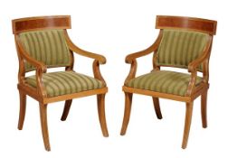 A pair of oak and pollard oak elbow chairs, in Empire style, 20th century, the upholstered