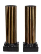 A pair of late Victorian style ebonised pine pedestal columns, 20th century, of fluted design and
