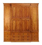 A breakfront satin birch wardrobe, circa 1860 and later, the large central double wardrobe with
