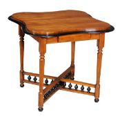 An Anglo Ceylonese satinwood and ebonised occasional table, circa 1890, with quatrofoil top above