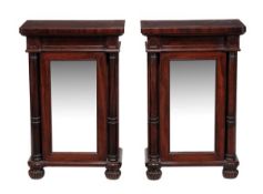 A pair of mahogany pier cabinets, circa 1825 and later, in the manner of Gillows, one stamped with