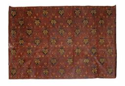 A roll of embossed and parcel gilt leather, late 19th early 20th century, with repeat floral motifs