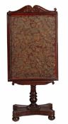 A William IV mahogany pedestal fire screen, circa 1835, with scroll top above extendable