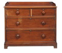 A Victorian mahogany chest of drawers circa 1840 with a three quarter shaped gallery and a moulded