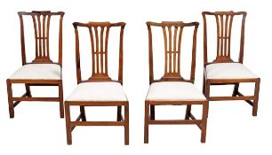 A set of four Colonial hardwood dining chairs in George III style, the tapering rectangular backs