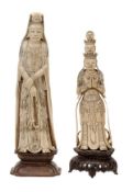 A Chinese ivory figure of Guanyin, she stands with hands crossed before her as she holds a rosary