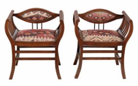 A pair of Edwardian stained beech hall seats, circa 1905, each with upholstered elliptical back,