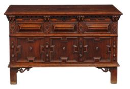 A Charles II oak and inlaid panelled chest, circa 1670, the hinged mitre panelled front