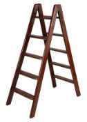 A set of hardwood `housekeepers` steps, 20th century, the hinged `A` shaped frame with steps on
