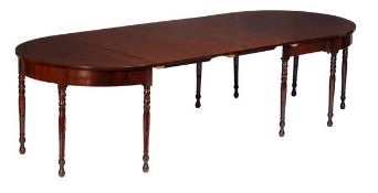 A George III mahogany D end extending dining table, circa 1800, with two additional leaf insertions