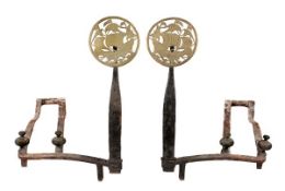 A pair of wrought iron and brass mounted andirons in Arts and Crafts style, late 19th century, each