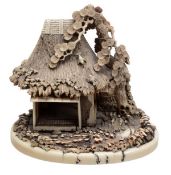 A Japanese ivory carving of a rustic tea house surrounded by pine trees, signed to the base, late