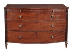 A Regency mahogany bowfront chest of drawers, circa 1815, the shaped top above brushing slide and