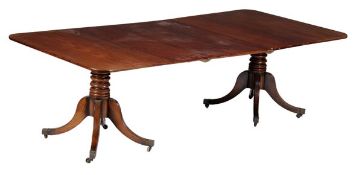 A George III mahogany twin pedestal dining table, circa 1770 and later, with substantial turned