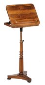 A Regency rosewood music stand, circa 1830, with adjustable ratchet action top above an adjustable
