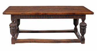 An oak refectory table in 17th century style early 20th century with a cleated top with rounded