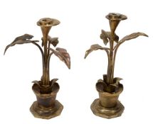 A pair of Continental gilt metal candlesticks, late 19th century, the sockets within flowerheads on