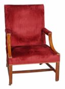 A George III mahogany and upholstered armchair, circa 1770, of Gainsborough type, the rectangular