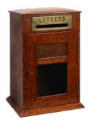 A Victorian oak and glazed domestic posting box, late 19th century, of rectangular form, the